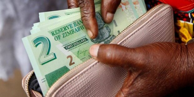 Zimbabwe adopts new currency to fight galloping inflation